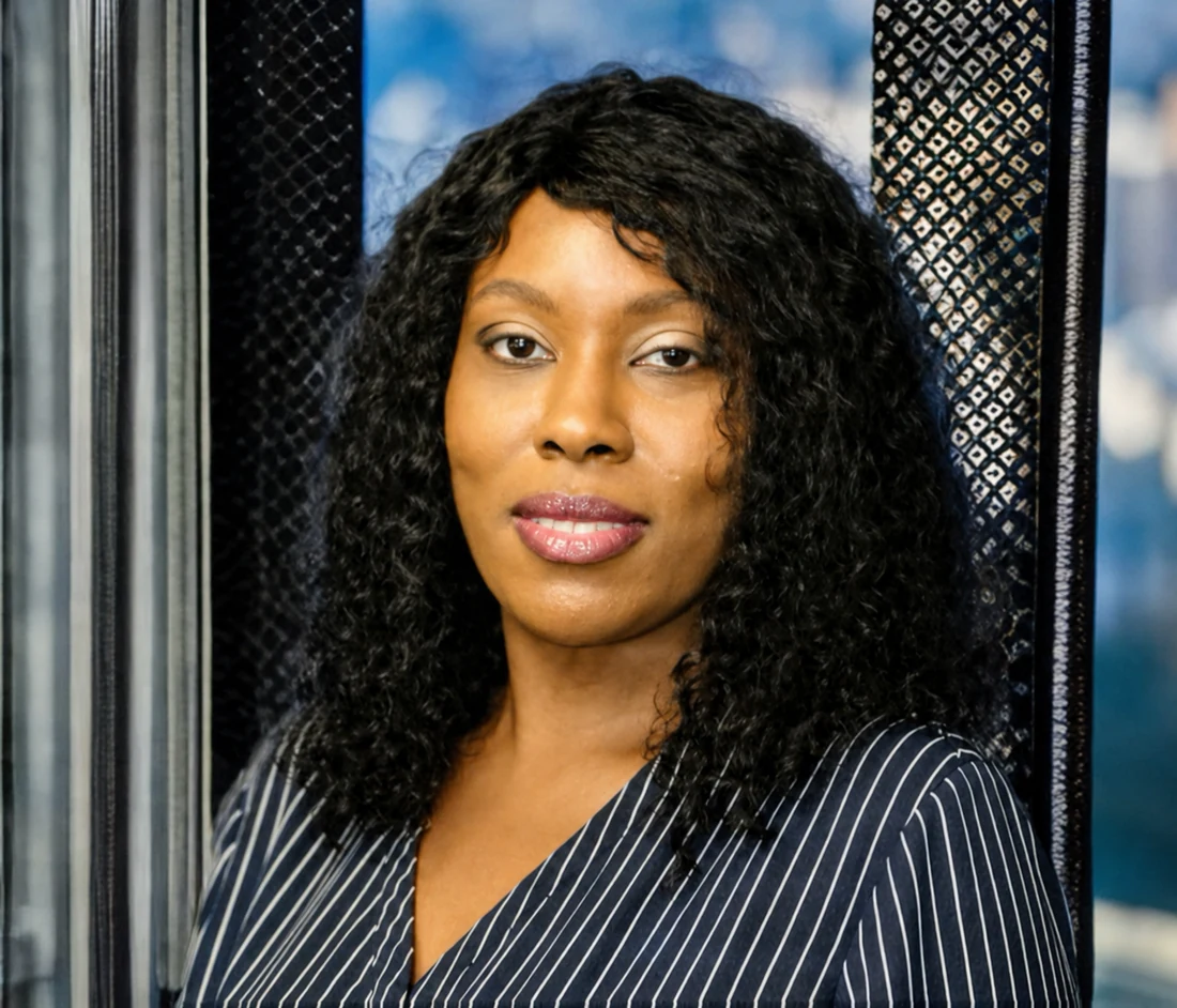Shavanesse “Shae” Grant, insurance producer and financial professional, in a navy pinstriped blouse